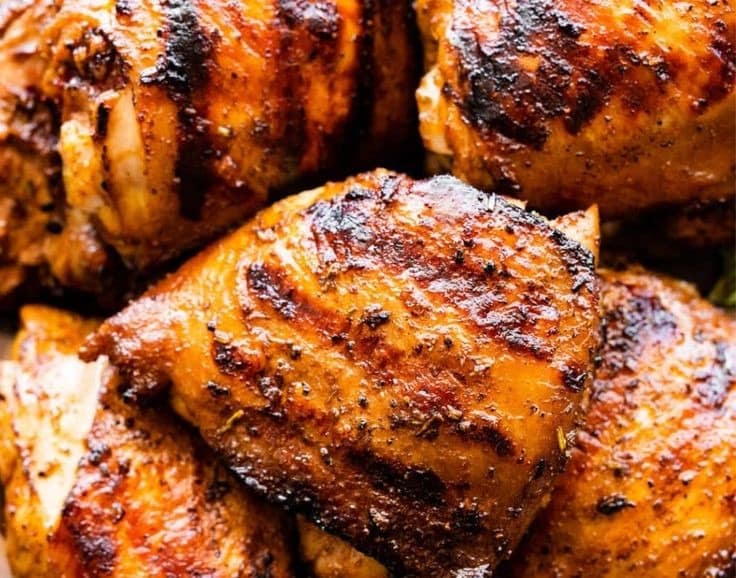Juicy grilled chicken thighs marinated in zesty Italian dressing, charred to perfection with crispy edges and bold flavor—an easy summer grilling favorite.
